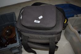 A Crane fishing tackle bag containing a selection of vintage reels