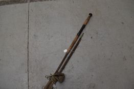 A vintage split cane rod with sleeve
