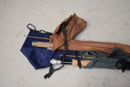 Three vintage fly fishing rods with sleeves