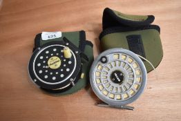 A Pflugers medalist fly reel and a Ryobi 355 fly reel