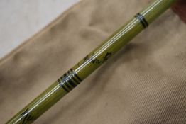 A Vintage 2pc fishing rod in sleeve marked John Robertson Newcastle