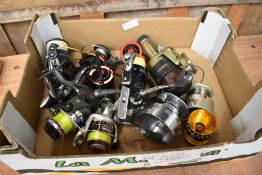 A Shakespeare Agility spinning reel with s spare spools plus 5 other spinning reels including