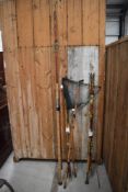 3 vintage cane or bamboo fishing rods with no markings and a similar fishing net