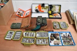 A large collection of fly boxes and fly wallets many containing trout and salmon flies