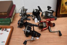 an assortment of 6 spinning reels including shakespeare and mitchell