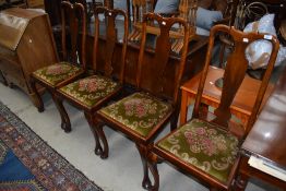 A set of early 20th Century vase back dining chairs having Queen Anne style legs