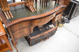 An early to mid 20th Century serpentine front desk or dressing table of cabriole legs