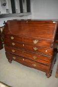 A 19th Century mahogany bureau in the Georgian style having fitted interior , two over three
