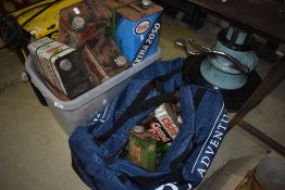 A large collection of oil cans, including Castrol etc