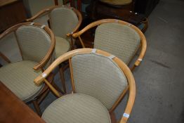 A set of four Ercol kitchen armchairs