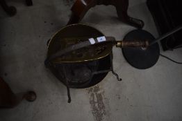 A traditional brass jam pan and trivet