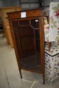 An Edwardian mahogany corner display cabinet having inlay decoration