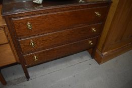 An early 20th Century oak bedroom chest of three long drawers