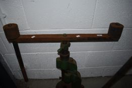 A vintage industrial bench mounted pipe bender.