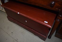 A stained frame blanket box