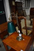 A vintage brass desk lamp