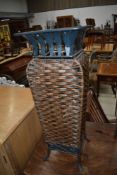 A modern metal and cane effect stick stand
