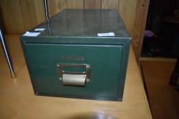 A vintage index card filing drawer, in a military style
