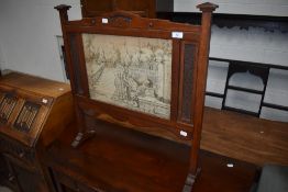 An Arts and Crafts fire screen, oak, in the Arthur Simpson or similar style