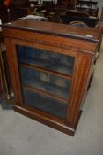 An Edwardian mahogany empire style display cabinet having inlay decoration