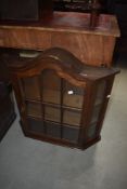 A traditional oak framed wall display, of small proportions