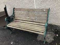 A traditional garden bench having cast ends