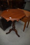 A Victorian style occasional table having octagonal top, turned column and triple splay legs,