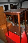 An Edwardian mahogany occasional table having line inlay decoration to slender tapered legs, width