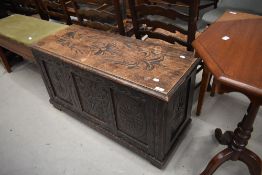 An early 20th Century carved kist style bedding box, width approx. 100cm