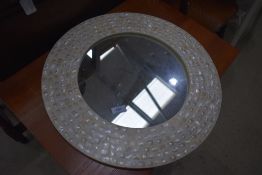 A circular wall mirror, pearlescent effect, diameter approx. 49cm