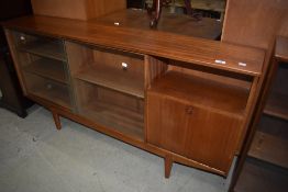 A vintage teak bookcase with cupboard to side, width approx. 153cm
