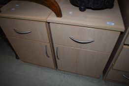 A pair of beech laminate bedside chests