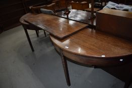 A pair of 19th Century mahogany D end tables and centre leaf