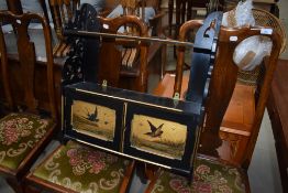 A Vitorian ebonised wall cabinet having painted pictorial panels to doors and giltwork detail, width