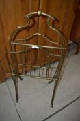 A vintage heavy brass magazine rack