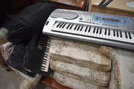 Two Yamaha PSS-790 keyboards and a Casio Keyboard, with one travel bags
