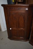 A Victorian pitch pine corner cupboard, in the Gothic style