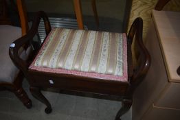 An early 20th Century piano stool with later top