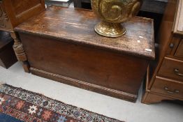 A traditional stained pine blanket box, width approx. 102cm