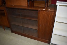 A vintage sapele bookcase with cupboard to side, width approx. 122cm