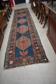 A Kazak style carpet runner, approx. 440cm x 100cm