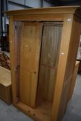 A modern golden oak effect wardrobe