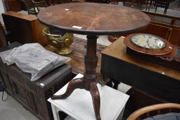 A 19th Century mahogany pedestal table having circular top on turned column and triple splay legs,