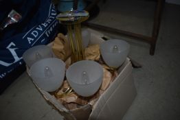 A modern brass ceiling light fitting