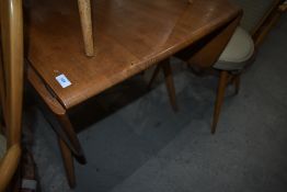 An Ercol drop leaf dining table