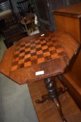 A Victorian mahogany occasional pedestal table having chequers top