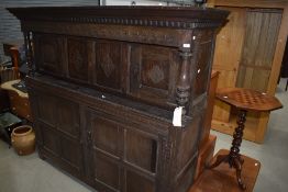 A period oak court cupboard having typical decoration, width approx. 190cm