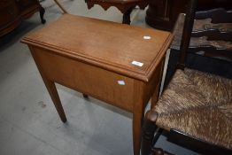A traditional oak sewing box and contents