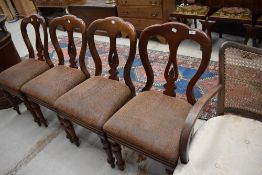 A set of four 19th Century mahogany slit back dining chairs
