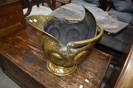 A hammered brass coal helmet